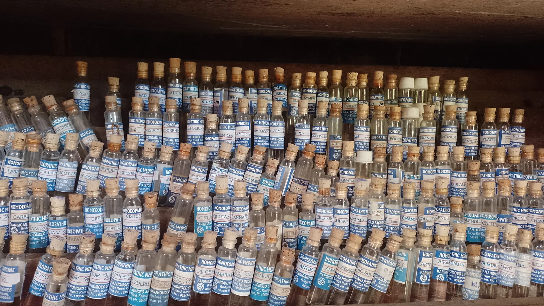 Representative photograph of homeopathic medicine containers on shelves